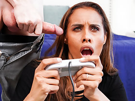 Kylie Le Beau sucks cock while playing video games.