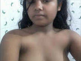 Pretty Indian girl gets dressed after taking a bath