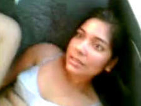 Beautiful couple having sex in a car