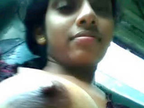 Busty woman gets her breasts sucked on a bus