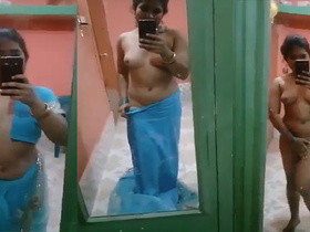 Sexy babe takes naughty selfies while stripping