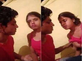 Desi lover enjoys passionate kisses and tries to show off her breasts