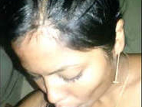 Indian girl giving oral pleasure to a man