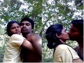 Passionate Indian couple kisses passionately outdoors