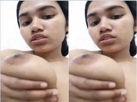Indian girl with large breasts featured in a pornographic video