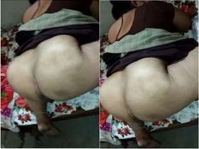 Desi wife gives her husband a handjob while he lies on the bed