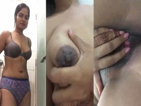 A stunning and seductive woman records a video in the bathroom