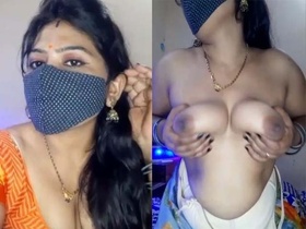 Huge-breasted Indian woman performs a seductive sexual show