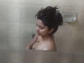 Hidden camera captures nude Indian girls in the bathroom
