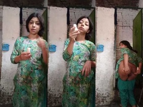 Curvy Indian babe seductively handles a banana in front of camera