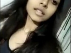 Beautiful babe seductively undressing on stage