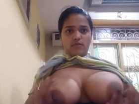 Indian girl with big boobs takes a selfie while pressing them together