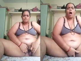 Elderly woman masturbates on camera with tight vagina