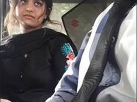 Adorable desi girl in a cute car