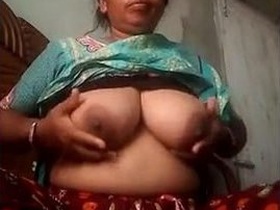 Sexy bhabhi flaunts her big boobs and slippery pussy
