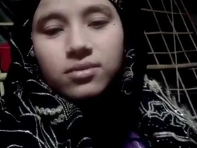 Desi wife wearing hijab teases lover with sexy moves