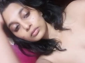 Young woman captures her own nude self on video