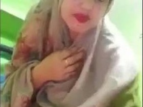 Naughty wife in hijab gets naked and plays with her pussy