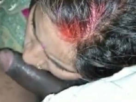 Desi wife plays with her husband's cock while giving him a blowjob