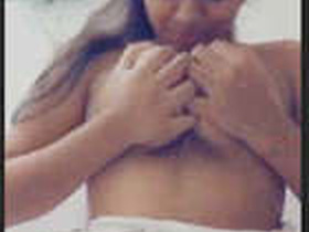 A stunning woman flaunts her body in the restroom