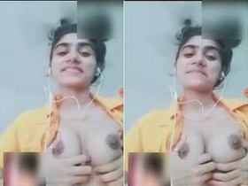 Exclusive video of a cute Indian girl flaunting her breasts and genitals