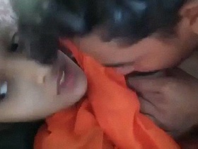 Indian teenage lovers indulge in boob sucking on the couch