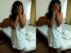 Shy Indian girl hides her face in explicit video