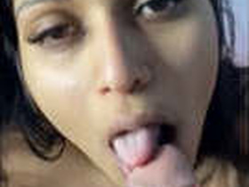 Desi girl sucks on lollipop while giving a blowjob