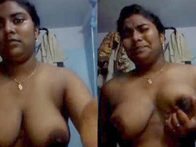 Indian teenager fondles her breasts with a seductive gaze