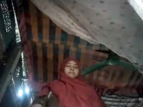 Muslim woman reveals her ample bosom and intimate area in village setting
