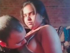 Rajni's big boobs get some attention from her husband in this video