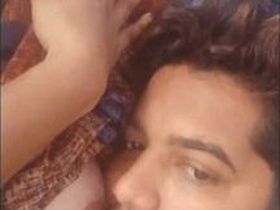 Lover enjoys sucking boobs of girlfriend