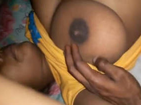 Tamil wife fondles her large breasts