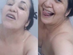Aunty indulges in shower fun with her lover