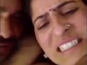 Desi aunty fondles her big boobs in this steamy video