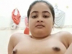 A seductive Indian woman bares it all in the bathroom