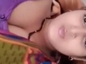 Indian bhabhi with big cleavage teases fans in a cute video