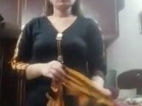 Full-figured wife strips down and shows off in four nude videos