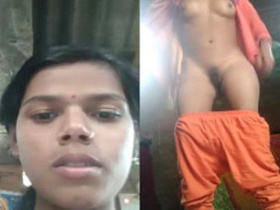 A stunning Indian teenager showcases her intimate parts in a garage