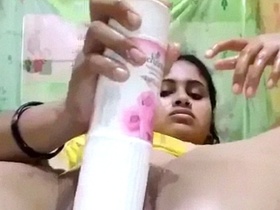 Sexy Desi chick uses a bottle of air freshener for dildo play