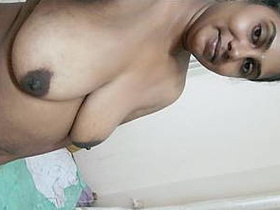 Desi auntie masturbates with her fingers in front of the camera