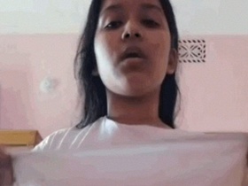 Watch a sexy Indian girl strip naked and get naughty