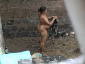 Desi MILF's nude outdoor bathing captured in secret