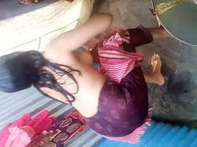 Desi girl enjoying a shower in her village