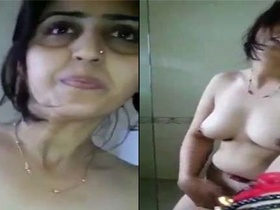 Indian village wife shows off her big boobs and fingering skills