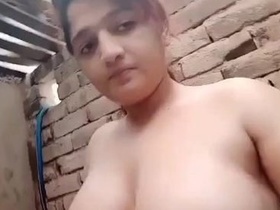 Watch a sexy Indian girl play with her big boobs in the bath