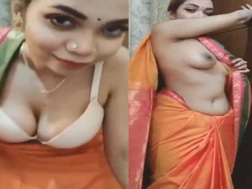 A stunning Bengali bhabi flaunts her curves in a striptease show
