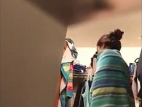 Indian girl modifies her clothes in the restroom
