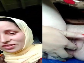 Beautiful wife pleasures herself with her fingers in selfie video