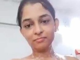 Nude Indian girl bathes in a video clip